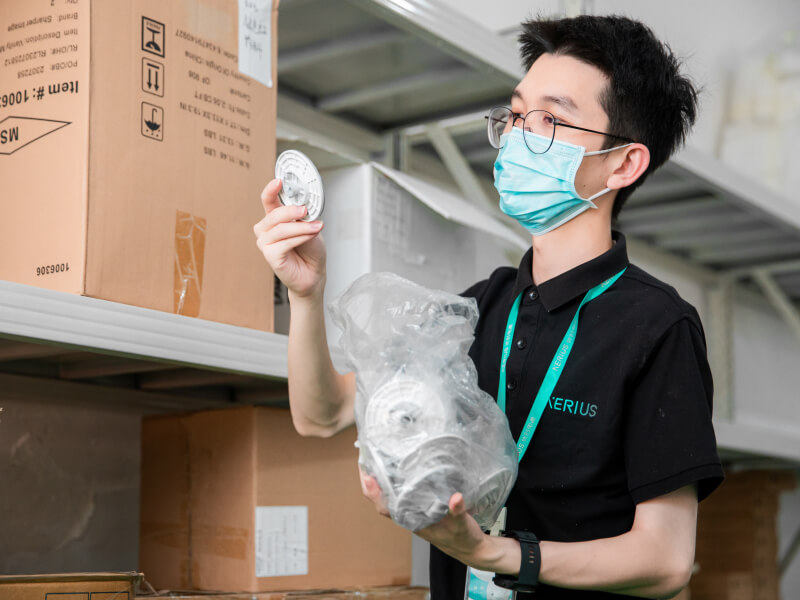 man inspecting a shipment of LED lights