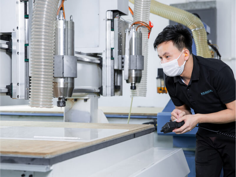 man monitoring the production equipment